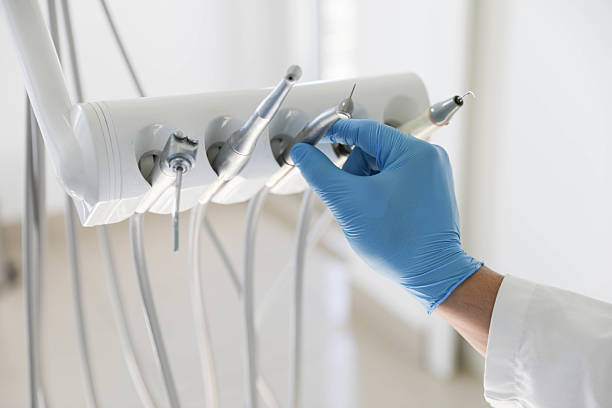 Professional Tooth Extraction technician working in Caldwell County County, TX
